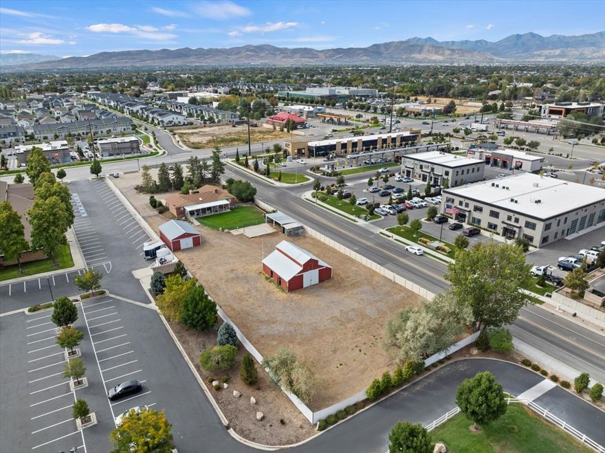 Value is in the Land.  Waiting to be Developed. Commercial Potential. Would need to be rezoned with SJ City.  Rambler style home with den w/closet.  which is 3300 square feet. Barn with Stalls, Loft & tack room but machine shop in separate out building.  ***Do Not Disturb Owners without Appointment...*** Do NOT enter property without Appointment.***  Shown by Appointment Only and Must provide Lender Approval Letter for showings.*** 1.09 acre lot.  plus the City of South Jordan owns the small parcel on 11400 South/currently used as parking for local business.. could possibly be purchased also. Questions can be directed to South Jordan City.** Great opportunity to be near everything & right off Redwood Rd.