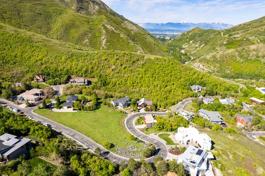 Located in the gated neighborhood of Emigration Place, this gradually sloping, .57-acre homesite offers a rare opportunity to build the home you've always dreamed of in a quiet, established neighborhood on Salt Lake City's scenic East Bench. Enjoy sweeping Wasatch Mountain views, tranquil surroundings, and quick access to the city's best amenities. Located just minutes from downtown Salt Lake City, the University of Utah, SLC International Airport, hospitals, world-class ski resorts and plenty of hiking and biking trails, this property combines the serenity of suburban living with unbeatable urban convenience. Whether you're ready to break ground right away or planning for the future, this is your chance to build in an exclusive community that is truly one of Salt Lake's best kept secrets.
