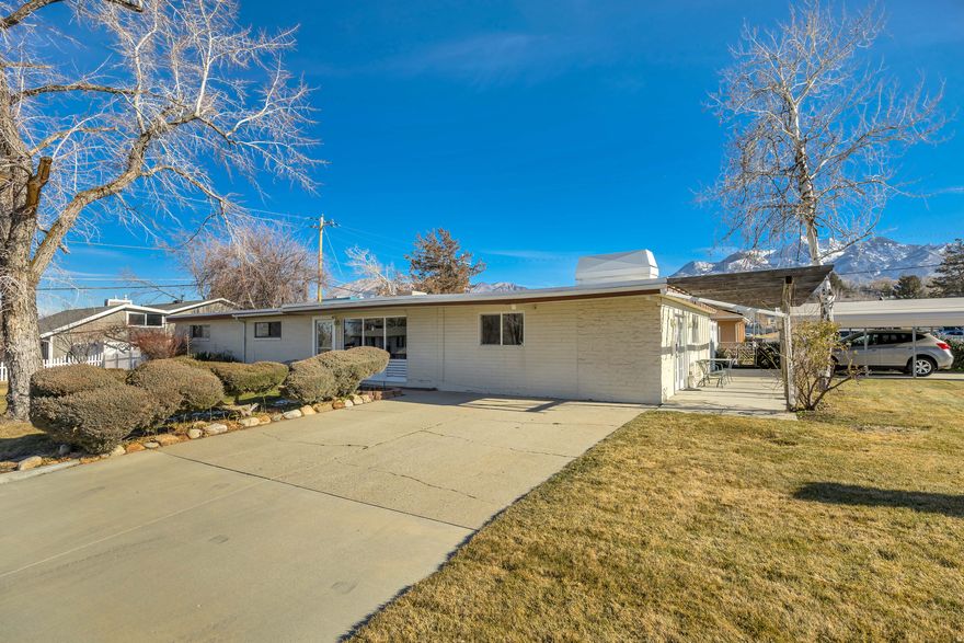 GRAND OPEN HOUSE SATURDAY JAN 24th, 12:00-2:00 pm. Enjoy true SINGLE-LEVEL LIVING in this highly desirable east-side neighborhood featuring mountain views, close to everything, & an elementary school just minutes away!*This kitchen features ample cabinets, generous counters space, stainless appliances, LARGE WALK-IN PANTRY, & efficient layout that connects easily to dining area*You'll love your large separate family room featuring ROCK GAS FIREPLACE perfect for movie nights or gatherings flowing out your true French doors to large patio*Classic character including ORIGINAL HARDWOOD FLOORS, exposed wood beam, & large windows*Step outside to your PRIVATE BACKYARD RETREAT featuring a covered patio, hot tub, mature fruit trees, & large shed*This home features TONS OF STORAGE, NEWER ROOF(5 years) & SEWER LINE(7 years), NEW WATER HEATER(3 months), This home is well maintained, easy to live in & even easier to love!*Square footage figures are provided as a courtesy estimate only and were obtained from county records. Buyer is advised to obtain an independent measurement
