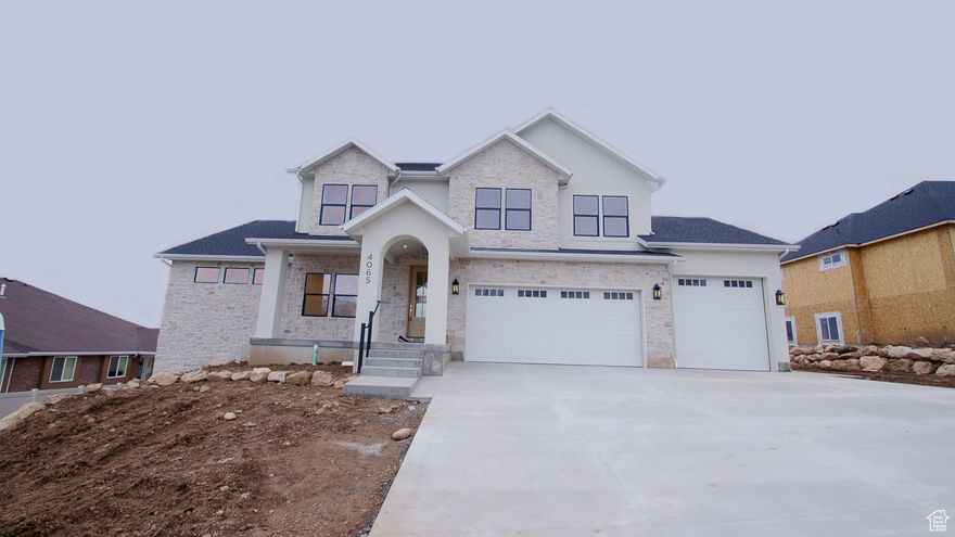 Don't miss your chance to own this incredible single-family home nestled in one of North Ogden's most desirable locations. Featuring 5 bedrooms, 3 bathrooms, and just over 5,000 sq ft of thoughtfully designed living space, this home sits on a generous 0.32-acre flat lot with a fully usable backyard-perfect for entertaining, playing, or relaxing.  Enjoy views of both the valley and surrounding mountains from nearly every window. The home will showcase two-story ceilings in the living room for that wow factor, plus a gourmet kitchen designed to impress. Located just minutes from hiking trails, parks, and all the conveniences of North Ogden, this home offers the perfect blend of natural beauty and modern living.  Lender Incentives available with preferred lender. Call Agent with any questions.