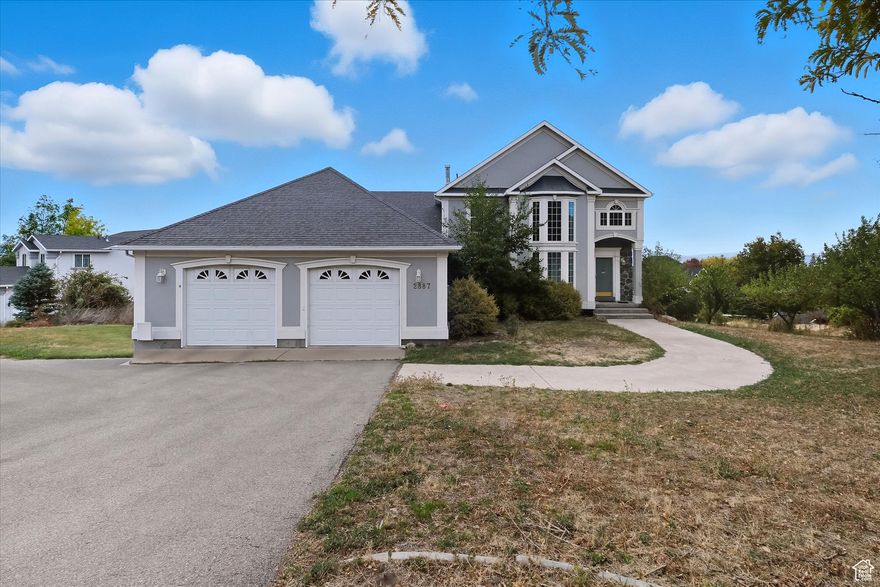 Beautiful home featuring large windows, vaulted and cathedral ceilings, and three fireplaces. The updated kitchen includes granite countertops and backsplash. A built-in office, loft, and solarium/atrium add great versatility. The basement offers full-size windows and built-in blinds in French doors for plenty of light. The primary suite includes a jetted soaking tub, separate shower, and bay windows. Circular driveway, mature trees, and a great yard for play or entertaining.