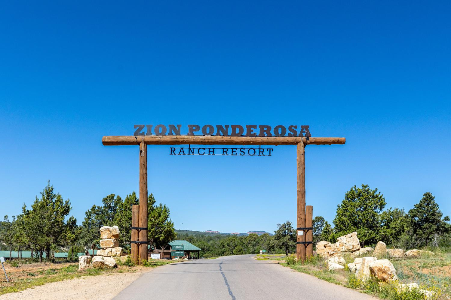 Rustic timber-framed entrance sign to Zion Ponderosa Ranch Resort