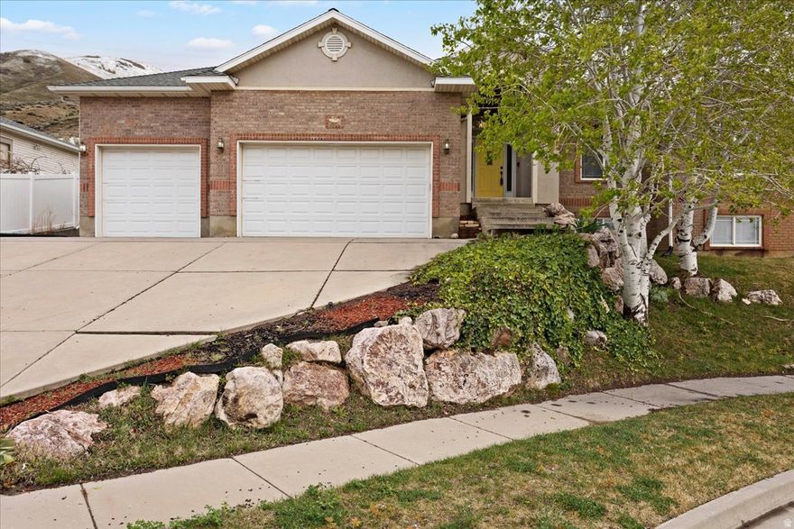Nestled on a quiet East bench cul-de-sac, this home offers spectacular mountain & valley views. Anderson Park is a quick two-block walk! Early shade with an East facing backyard.  Peace of mind with a newer 50-year roof and new air conditioner.  Inside, the updated kitchen features beautifully staggered knotted hickory cabinets. The main bedroom offers a tray ceiling and the bathroom has two sinks and a separate tub/shower.  3 of the 5 bedrooms boast spacious walk-in closets. Laundry has plenty of cabinets and a wash sink. The insulated garage door adds year-round efficiency.  The daylight basement is pre-plumbed for a full bathroom and ready for your touch. The kitchen toe-kick and garage vac port are  nice luxuries of the central vac system (equipment included).  This home is priced to sell quickly-don't miss your opportunity. Schedule your tour today!