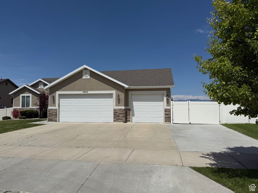 Gorgeous home inside and out. New carpet just installed. Beautiful updated home, well taken care of. Granite counter tops throughout. Master bathroom has double sinks, separate tub/shower. Walk in closet. Spacious family room, island in kitchen.  Refrigerator, microwave, washer and dryer included on main floor. Basement also has a full kitchen, microwave & refrigerator also included. Additional laundry room also in basement, and a walk-out basement entrance with french-doors to accommodate moving items into the basement. Possible ADU opportunity. Buyer to verify city requirements.  Basement has 3 additional large bedrooms, large closet in one. Full bathroom, and large living room. Long concrete RV parking. Enjoy the deck, and covered patio with ceiling fan and power for those outdoor get togethers. Beautifully landscaped and ready to move in.