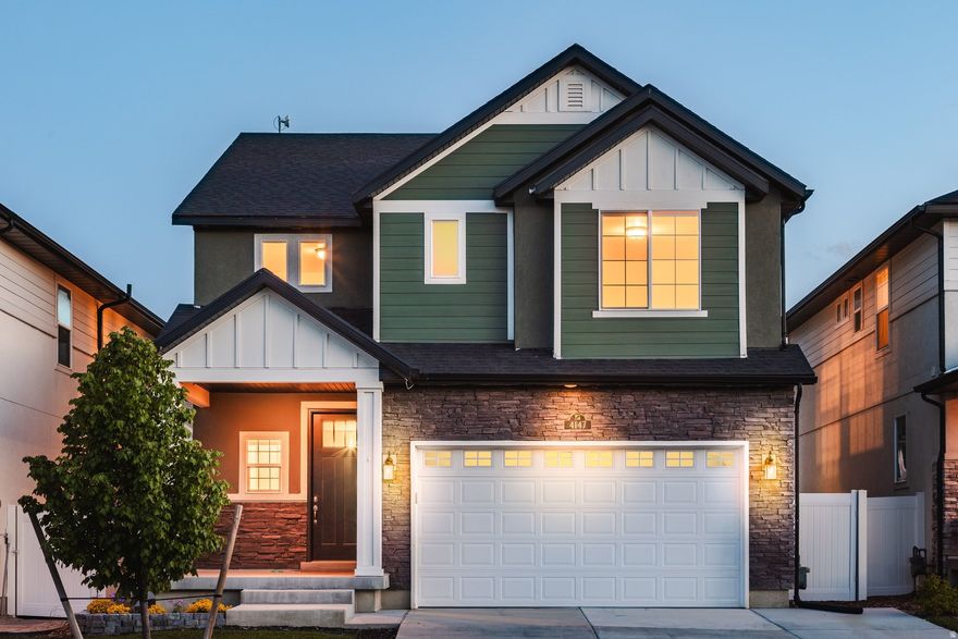 Welcome to this beautifully designed home in the heart of Lehi, where style, comfort, and thoughtful upgrades come together. You're greeted by an open, light-filled layout with tall ceilings and a warm, inviting feel. The main living space is perfect for everyday living and entertaining, featuring a stunning fireplace and large windows. The kitchen shines with quartz countertops, upgraded appliances, custom cabinetry, and a spacious island that flows seamlessly into the dining and living areas. You'll appreciate the modern finishes, designer touches, and functional spaces, including a bright office nook. The backyard offers low maintenance landscaping and fruit trees, creating a peaceful space to relax or entertain. With quick access to I 15 and just minutes from Silicon Slopes, shopping, and dining, this home is in an unbeatable location and truly move in ready.