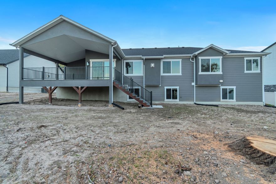 Serenely sited rambler home with generously sized rooms on secluded lot with a MASSIVE covered deck!  Home features a separate outside basement entrance and a 4-car garage (extra length).  From the Entry you glimpse the large vaulted great room with recessed lighting, large windows and fireplace.  This room opens up to the Study with glass doors and is adjacent to the generous kitchen - white cabinetry with granite countertops.  There are three good-sized bedrooms with the master having a large walk-in closet, 2 sinks and a separate tub/shower in the ensuite.  the laundry room is on the bedroom side of the house.  Downstairs there is plenty of light from the daylight-basement windows and it's ready for you to finish off as your own or as accessory living space with the separate exterior basement entrance. LVP hard-surface flooring everywhere except the bedrooms and stairs (carpet). Come see this home today!  (Finished photos in listing are from a similar home built elsewhere by the same builder.  Taxes are approximate as taxes for a finished home on this lot have never been assessed before).