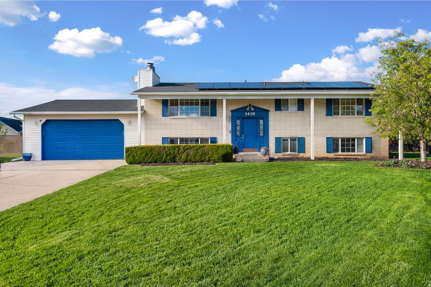 Finally!  A home that gives you space, flexibility, and long-term upside.  And it comes with a lender incentive up to $5,500 paid toward closing costs when using our preferred lender!  Tucked into a quiet cul-de-sac near the Syracuse border, this 6-bedroom home offers a layout that works for real life-whether you need room to grow, space for multi-generational living, or the opportunity to offset your mortgage with a separate basement setup.  The home has been thoughtfully updated with fresh paint and features a functional floor plan that gives you options most homes in this price range simply don't offer.  Step outside and you'll find a fully fenced .34-acre yard with mature trees and fruit trees, perfect for relaxing evenings, entertaining, or creating the outdoor space you've always wanted. The covered deck and patio extend your living space, and there's even a power hookup ready for a future hot tub.  Major systems have already been taken care of including newer HVAC, roof, and an upgraded electrical panel, giving you peace of mind from day one. Even better, the home comes equipped with paid-off solar panels, helping reduce monthly utility costs and adding long-term value.  Located in an established neighborhood with easy access to schools, parks, and commuter routes, this home blends comfort, flexibility, and smart financial potential.  If you've been looking for a home that gives you more than just a place to live-this is one you'll want to see in person.  Square footage figures are provided as a courtesy estimate only and were obtained from county records.  Buyer is advised to obtain an independent measurement.
