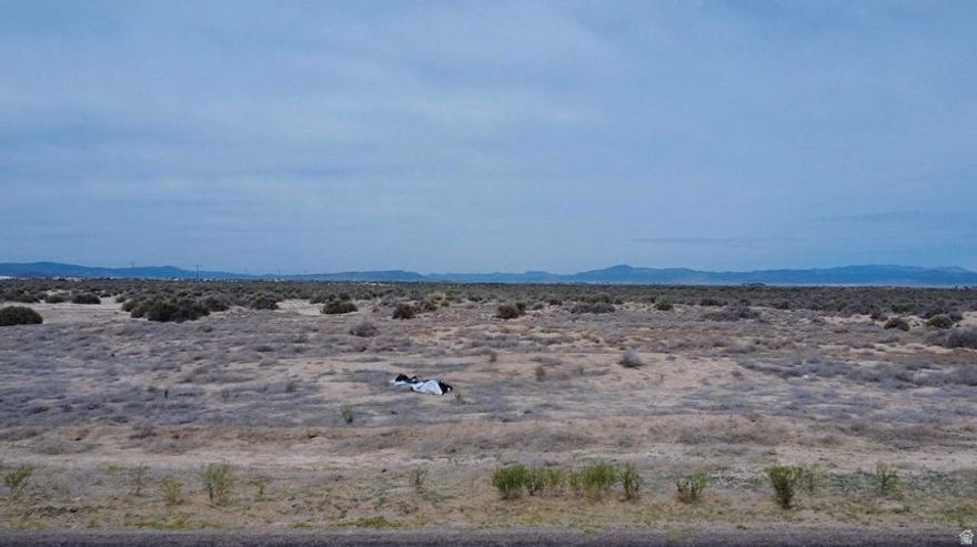 Rare opportunity to own 18.5 acres in Beryl, Utah with 0.5 acre-feet of valuable water rights included #71-4912 (1945). Right off of Beryl Highway with paved road access. Possible commercial applications. Perfect for building a home, cabin, barndominium, ranch property, mini farm, off-grid retreat, or recreational getaway. Plenty of space for livestock, horses, RVs, toys, gardens, orchards, or future development potential. Enjoy wide open spaces, privacy, dark night skies, and breathtaking desert and mountain views. Beryl is known for its peaceful rural lifestyle, outdoor recreation, ATV riding, hunting, camping, and easy access to Enterprise, Cedar City, and St. George. Water rights add tremendous long-term value in Southern Utah. Great investment, getaway, or future homestead opportunity