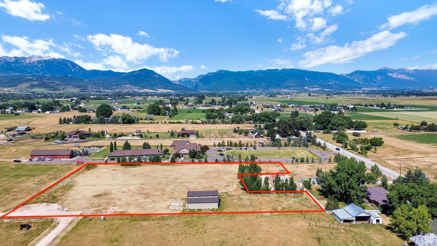 You've found your dream property featuring 100% usable land and panoramic 360-degree views! This lot has undergone extensive preparation to ensure it is ready for construction and features a 44 x 48 shop already in place. Unlike many properties, utilities here are not merely available but fully stubbed to the property, with all connection fees covered except for Dominion Energy. Typically, securing a water connection alone can cost upwards of $20,000; however, this property includes a fully prepared water connection. Key utilities already stubbed, paid for, and ready for immediate use include: Electrical: 200 amp service with meter base installed, equipped with RV hookup. Natural Gas: Line stubbed to the property boundary. Irrigation: 3" pressurized water line, accompanied by 5 shares of Huntsville Irrigation. Culinary Water: A 115-foot deep certified well, complete with an installed hydrant and pump, supplemented by 1 share of Weber Basin Water. Septic: Approved septic system plan, offering flexibility for a conventional system with a septic tank and leach field, the most economical option available. Additionally, professionally engineered house plans optimized for southern exposure during winter months are available upon request. Buyer to verify all information. Property lines displayed are approximate and for visualization purposes only.