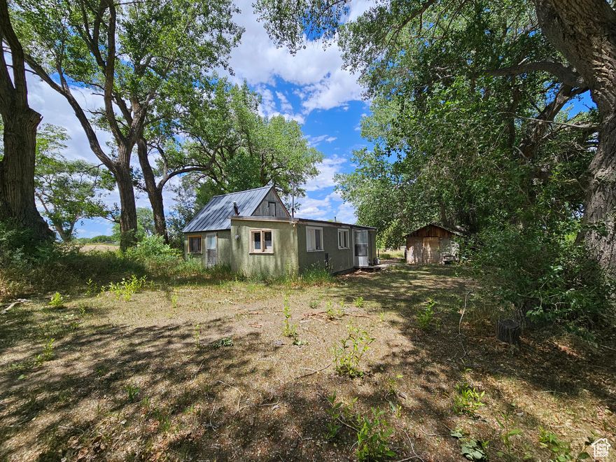 This home is being sold As-Is, and seller disclosures will not be provided. The home has no water line/connection, it is available at buyer's expense. There is a irrigation system that belongs to the neighboring property located in the middle of this property. Cash only and no seller financing/renting is being offered. Nice quiet peaceful lot with big beautiful trees, Located just south of Hwy 40 and driveway has an easement to this home with a family member's home located on Hwy 40 frontage.