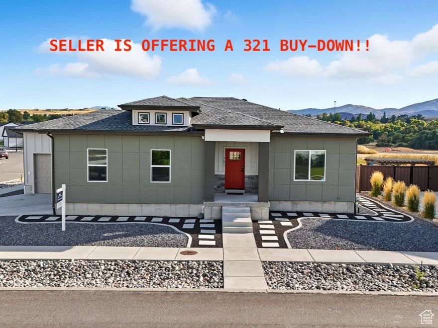 Seller is offering a 3-2-1 buy down! Welcome home to this stunning modern rambler, showcasing high-end finishes on both levels. The chef's kitchen features a premium Z-Line gas cooktop, drawer-style microwave, and extensive custom cabinetry and countertops. A versatile bedroom/office on the main level includes a custom built-in Murphy bed-perfect for guests or flexible use.  Expand your lifestyle outdoors with nearly 1,000 sq. ft. of covered deck space offering unforgettable views of the Wellsvilles. The lower level is equally impressive, featuring an additional washer/dryer hookup for added convenience.  This home also includes a $6,000 full holiday permanent lighting package and a complete exterior camera system for added peace of mind. Thoughtfully maintained with a low-maintenance xeriscaped yard, this residence blends style and functionality seamlessly-truly a special place to call home.