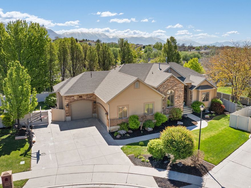 Beautifully updated and truly move-in ready, this home, with its stunning mountain views is designed for easy, enjoyable living with single level convenience and a wide range of upgrades throughout. You'll feel like you're walking into a brand new home with new LVP flooring, fresh paint, new blinds, new carpet, new Trex deck, new Furnace, and new AC. The kitchen was updated a few years ago with new counter tops, added island, all new appliances, and induction oven. The large pantry, laundry and mud room are conveniently located off the kitchen. The spacious primary suite features dual walk in closets, a soaking tub, a separate shower, and direct access to the back deck to enjoy the views and relax.  Built for entertaining and everyday fun, the large .33 acre property offers multiple outdoor gathering areas, an outdoor playground, basketball hoop, a large fire pit sitting area, and naturally shaded afternoons that create a private retreat for both large and intimate gatherings. Adults and kids enjoy the indoor slide and the gym room. The lower level has an apartment with a private entrance and its own walkout patio-ideal for multigenerational living or rental income. Additional highlights include an oversized 3 car garage with an EV charger, solar panels add valuable energy saving benefits, RV parking, and generous storage areas throughout. The home is ideally located minutes from shopping, schools, soccer fields, trails, Thanksgiving Point, and Dry Creek Park with its disc golf course. You'll love the easy freeway access to downtown Salt Lake City, the Salt Lake International Airport, Provo, and nearby ski resorts.