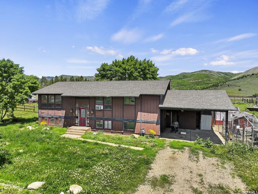 Here's your opportunity to buy a fixer-upper in coveted Ogden Valley! This property is being sold "as is", sitting on almost one acre.  In this split-level home, you'll find three bedrooms and two bathrooms on the upper level. The kitchen has wood floors and an open floor plan. Just off the kitchen are washer and dryer hook ups. Downstairs there is one completed bedroom and two unfinished flex rooms. Surrounded by incredible mountain and valley views, this diamond in the rough is full of potential and is waiting for your unique vision. All property information, boundaries and documents to be verified by buyer.