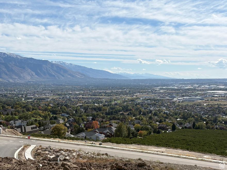 Nestled High on the Beautiful Pleasant View Bench, this stunning 0.40-Acre lot showcases sweeping Mountain and valley views along with breathtaking sunsets. The property offers the perfect setting for a custom home designed to highlight the area's natural beauty and serene surroundings. Enjoy the peaceful atmosphere while being just minutes away from hiking trails, skiing, parks, and local conveniences. this rare view lot provides an exceptional opportunity to build your dream home in one of Pleasant View's most desirable locations.