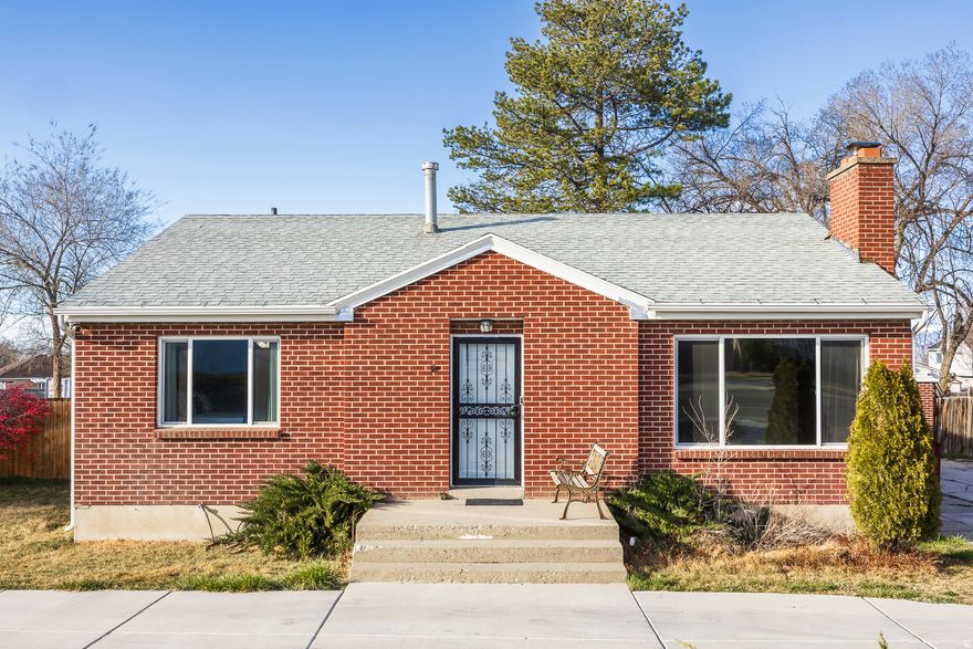 Spacious brick home situated on a .65-acre lot with incredible potential. This property features 4 bedrooms, 2 bathrooms, and a large family room in the basement. The home includes a detached 2-car garage and a large driveway added in 2021 for additional convenience and accessibility. Enjoy the backyard with a covered deck and patio added in April 2022 and a hot tub installed in May 2022-perfect for relaxing or entertaining. The expansive lot offers endless possibilities. According to West Valley City, the property may be eligible to be subdivided; however, buyers are advised to conduct their own due diligence regarding subdivision potential. Property also has animal rights.Two storage containers located at the back of the property are included in the sale. Square footage figures are provided as a courtesy estimate only and were obtained from county records. Buyer is advised to obtain an independent measurement.