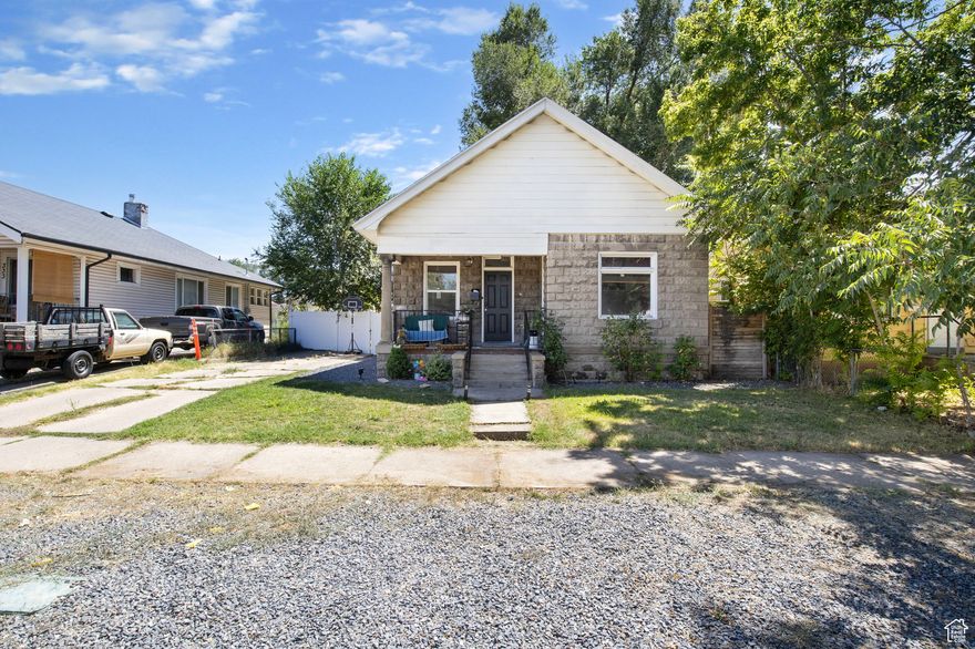 Discover the charm of this delightful cottage, ideal for those seeking a mix of vintage character and modern potential. Located in a peaceful neighborhood, this property presents a unique opportunity for homebuyers or investors.  The home features three bedrooms, one bathroom, a remodeled kitchen, and a spacious living room. The expansive backyard offers endless possibilities for customization and landscaping. It is conveniently situated near parks, schools, and shopping areas. With some updates and personal touches, this property could be transformed into your cozy dream home. Additionally, this unique offering includes two lots being sold together.