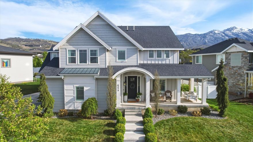 Welcome to your dream home in the coveted Skye Estates community! This beautifully appointed 6-bedroom, 3.5-bath home offers an open and inviting floor plan designed for both everyday living and entertaining. The generous great room features a cozy fireplace with built-in cabinetry and flows seamlessly into the gourmet kitchen, complete with double ovens, a gas range, quartz countertops, and a large walk-in pantry. Soaring nine-foot ceilings, extra-wide stairways and hallways, hardwood floors, and abundant natural light enhance the home's spacious feel throughout. Upstairs, you'll find four large bedrooms, a generously sized loft perfect for a playroom or second family room, a spacious laundry room with built-in cabinetry, and a convenient Jack-and-Jill bathroom. The luxurious primary suite features a large walk-in closet and a spa-like bathroom with dual sinks, a soaking tub, and a separate shower. The finished basement offers incredible versatility with a private guest suite with access to a full bathroom, an additional bedroom, a large family room, a fun under-the-stairs play space, and a massive cold storage room with built-in shelving. A three-car garage provides ample room for vehicles and additional storage. Step outside to enjoy fun-filled days on your private backyard pickleball/sport court, or relax on the wraparound front porch while taking in stunning mountain and lake views at sunset. The  home is ideally located directly across from the neighborhood park, featuring a playground, picnic area, and walking path. Skye Estates boasts exceptional community amenities, including a pool, gym, and clubhouse with a private theater available for events. With easy access to shopping, dining, and top-rated schools, this home offers the perfect combination of space, luxury, and location. A truly rare opportunity-don't miss it! Square footage figures are provided as a courtesy estimate only and were obtained from previous MLS listing. Buyer is advised to obtain an independent measurement.