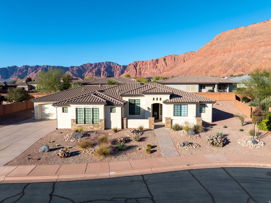 Enjoy beautiful Red Mountain views from the covered patio or courtyard of this immaculate 4-bed, 3-bath home. It features a gourmet kitchen with premium cabinetry and double-thick granite, a water softener, central vacuum, monitored security system, surround sound (including patio speakers), Control4 smart-home technology, and added R-50 insulation. The newly painted exterior, xeriscape landscaping, and epoxy-coated 4-car garage-with abundant built-in storage-ensure low-maintenance living. No HOA, and space to add a pool and RV pad. There are select furnishings available for purchase. This property blends luxury, functionality, and flexibility in one exceptional package!