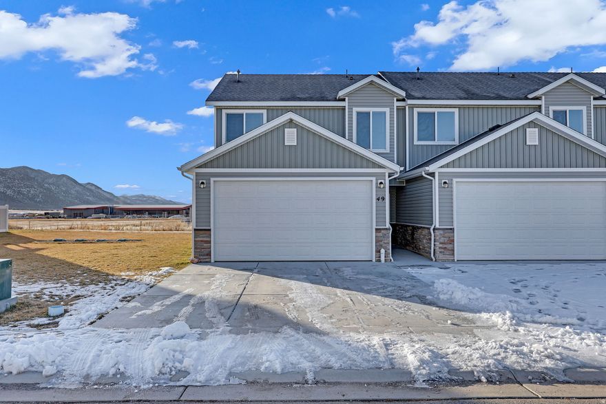 This beautiful, just like brand new townhome features 3 spacious bedrooms and 2.5 modern bathrooms. The highlight of the home is the stunning white kitchen, complete with elegant cabinets, granite countertops, stainless steel appliances, including a stove, overhead microwave, dishwasher, and refrigerator. Inside, you'll find numerous upgrades that enhance both functionality and aesthetic appeal, making it a tremendous value for a like-new home. The design is not only stylish but also thoughtfully laid out to maximize space and comfort. Additionally, the home boasts an impressive 95% efficiency rating, ensuring energy savings and a comfortable living environment year-round. This townhome is perfect for anyone seeking luxury and convenience in a prime location. Check out the great price on this compared to the New Builds in the same area.