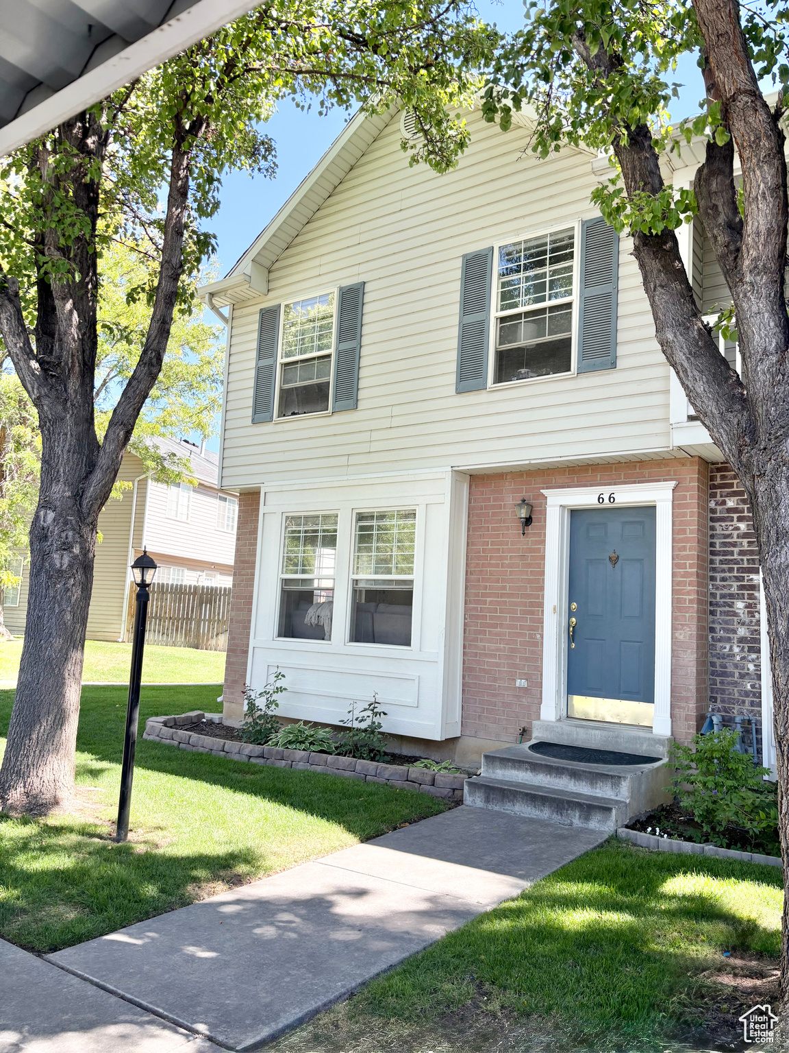 Adorable two-story end unit with a blend of privacy, convenience, and style in this beautiful townhome, just moments from top-rated schools, shopping, dining, grocery stores, and everyday essentials- new beautiful LVP flooring throughout the main level. Step outside to enjoy access to a spacious backyard. Residents also have access to a well-maintained playground and a charming community picnic area. With quick and easy access to I-15, this home makes commuting effortless.
