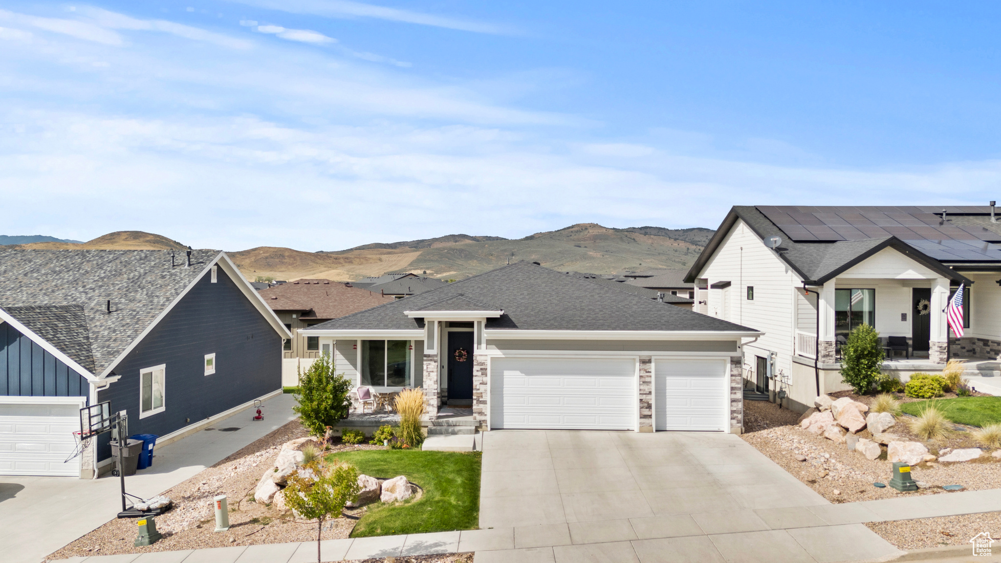 Beautiful Rambler in the scenic rolling hills of Mountain Green. Enjoy the views and proximity to Snowbasin resort. Located in a new community in the exclusive Cottonwoods at Mountain Green. This neighborhood is Fantastic! This custom, single-family home features the convenience of single level living yet has a full finished basement for more space, storage or enjoyment. This yard is taken care of by the HOA! This amazing feature eliminates all the hours in the yard. What a great feature built in to the HOA. This home is custom built with 2 Large Granite Islands in the Kitchen. An open great room. 3 bedrooms on the main level and 2 more bedrooms downstairs. The kitchen walks out to the patio for enjoying the mountain air and the amazing views. The master suite has double sinks and a large walk in closet. There is even a drinking fountain upgrade in the upstairs as you enter the home from the garage. This home features a 3 car garage. Downstairs you will find 2 bedrooms, a large full bathroom and an extra large family room for ping pong, playing games or watching TV, Movies etc. Dont miss out on this beautiful home!