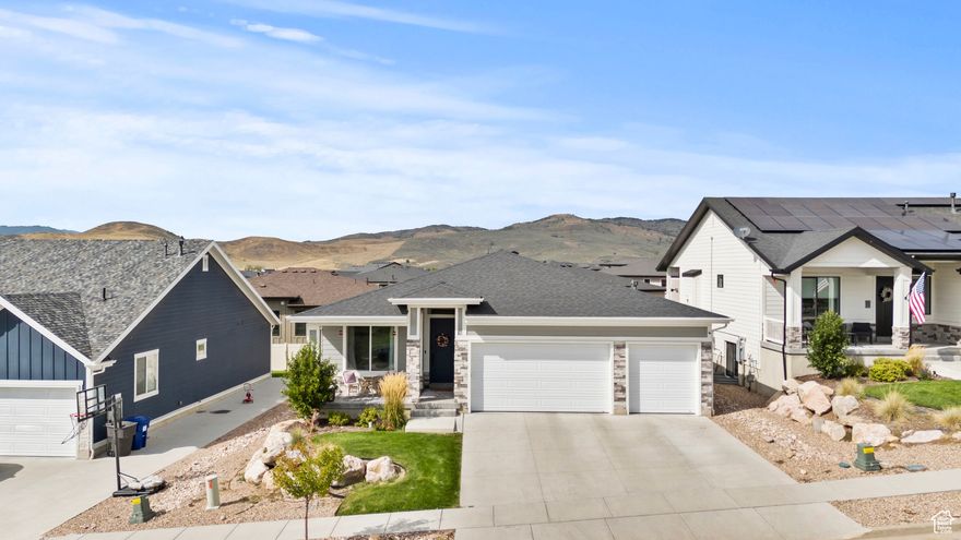 Beautiful Rambler in the scenic rolling hills of Mountain Green.   Enjoy the views and proximity to Snowbasin resort. Located in a new community in the exclusive Cottonwoods at Mountain Green. This neighborhood is Fantastic!  This custom, single-family home features the convenience of single level living yet has a full finished basement for more space, storage or enjoyment. This yard is taken care of by the HOA!  This amazing feature eliminates all the hours in the yard.  What a great feature built in to the HOA.   This home is custom built with 2 Large Granite Islands in the Kitchen.  An open great room.  3 bedrooms on the main level and 2 more bedrooms downstairs.  The kitchen walks out to the patio for enjoying the mountain air and the amazing views.  The master suite has double sinks and a large walk in closet.  There is even a drinking fountain upgrade in the upstairs as you enter the home from the garage.  This home features a 3 car garage.  Downstairs you will find 2 bedrooms, a large full bathroom and an extra large family room for ping pong, playing games or watching TV, Movies etc.  Dont miss out on this beautiful home!