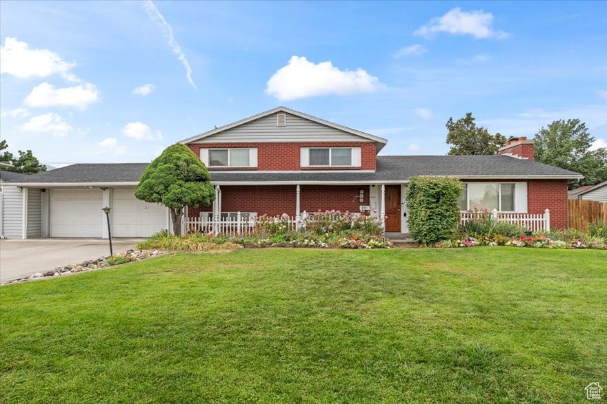Spacious and inviting, this home offers 4 bedrooms, 2 bathrooms, and an abundance of living space with three family rooms, including a large family room addition perfect for gatherings. The kitchen was tastefully updated in 2018 with beautiful cabinetry, and original HARDWOOD FLOORS lie beneath the carpet on both the main and upper levels, ready to be revealed.  Car enthusiasts and hobbyists will appreciate the oversized 2-car garage, designed double-deep to accommodate up to 4 vehicles with plenty of additional workspace.  Step outside to your private oasis - beautifully landscaped grounds with a serene koi pond and lily pads, perfect for relaxing or entertaining. Just a short walk to Wheeler Farm and minutes from I-215, this home blends convenience with incredible outdoor living. Water Heater and Furance have been updated in 2021, with a new roof added to the upper portion in May 2025. This home is move in ready and has been maticulaously taken care of.