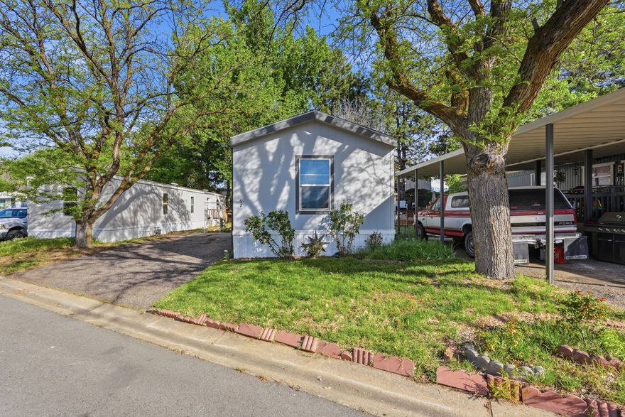 This well-maintained 2018 manufactured home offers comfortable, modern living in a convenient park setting. Ideally positioned within the community, the home is located across the driveway from a shared green space and recreational area, providing easy access to outdoor space.  Inside, the home features a clean, updated interior with an open layout that allows for natural light and functional living. The design offers a practical flow between living spaces, making it easy to enjoy day-to-day living or host guests.  Residents can enjoy nearby access to common outdoor areas, offering space for relaxation and recreation within the community.  This home presents a great opportunity for low-maintenance living in a well-located and established community.