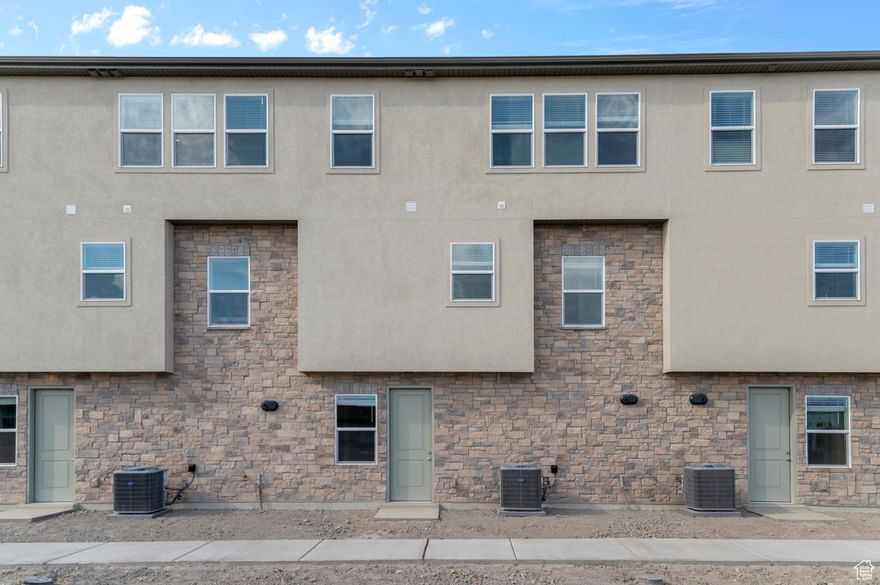 Come see this beautiful brand new Aspen townhome that offers a welcoming design with thoughtful finishes and modern conveniences throughout. This home features a kitchen that is beautifully appointed with white laminate cabinets, sleek quartz countertops, and stainless steel gas appliances, creating the perfect balance of style and function for everyday cooking and entertaining. The interior features a combination of laminate hardwood, vinyl tile, and soft carpet flooring, adding both durability and comfort to each living space. Craftsman-style base and casing enhance the home's clean lines and timeless appeal. The owner's bathroom provides a spa-like retreat, complete with cultured marble shower surrounds and elegant satin and brushed nickel hardware. Energy-conscious buyers will appreciate the tankless water heater and energy-efficient options, designed to provide modern comfort while reducing utility costs. With its bright finishes, functional layout, this home is the perfect blend of style, comfort, and efficiency.