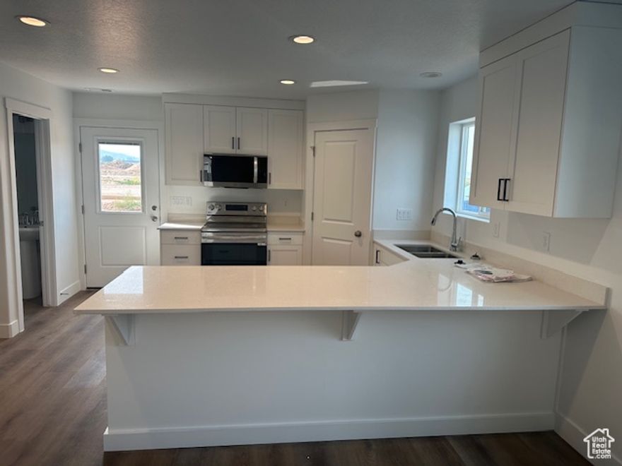 Amazing end-unit townhome by Desert Sage Homebuilders. Here you'll find incredible value at an accessible price point. Enjoy a functional, open floor plan, with a lovely kitchen with painted/stained cabinets, quartz countertops, nice corner pantry, open great room, laundry room, and a powder bathroom on the main level. Upstairs you'll find 2 bedrooms and the home's primary suite. The Cedar Breaks community is located in a great area with quick and easy access to I-15. This home would be a great primary residence or investment property! This unit does NOT have a garage, but does have a carport.*Photos of similar unit. *All information is deemed reliable but not guaranteed, buyer to verify all.