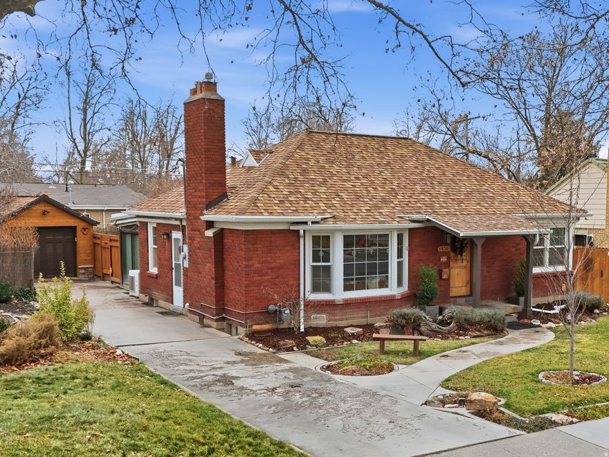 GRAND OPENING OPEN HOUSE Saturday 2/14, 11am-1pm, and Sunday, 1-3pm. MILLCREEK AT ITS BEST! An incredible house in an incredible neighborhood, this roomy bungalow has been improved in all the perfect ways. From the water feature and rustic front door to the covered pergola and lush mature landscaping in the back, you'll find warmth & charm at every turn. Walk in to a living room designed for guests and a kitchen updated for every convenience. Two bedrooms and a full bath allow ample main floor space. The basement hosts another bedroom & 3/4 bath, a huge laundry/utility room, and a roomy family room with ADU conversion possible. Best of all, the main floor features beautiful original hardwood floors that lead to a rich, warm sunroom. The biggest, brightest wall of windows faces your private back yard sanctuary; oversized sliding doors are energy efficient and easily blend indoor/outdoor living to the heated pergola, patio dining, and hot tub. A tandem 2 car garage has been updated for your cars, toys, & storage; fully fenced yard means your pets can roam freely & safely while you garden as much (or little!) as you like. Recent upgrades include roof, electrical, plumbing, kitchen, baths, and more... too much to mention (but come see the features list in person). Walking distance to Millcreek Commons with restaurants and shopping, close freeway access to come & go easily. Schedule a tour! Once you visit this amazing city oasis you may never want to leave.