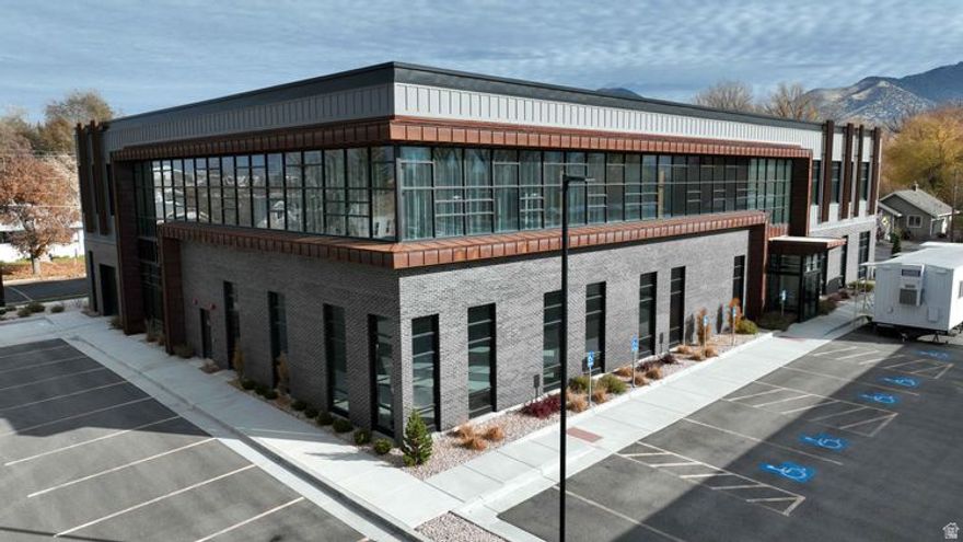 Logan UT 27,185 sqft. office building on the Logan River. Incredible two-story building with private covered parking. Income from solar panels. Highly secured building with many options. Excellent investment opportunity. Near Riverwoods conference center restaurants and shops.
