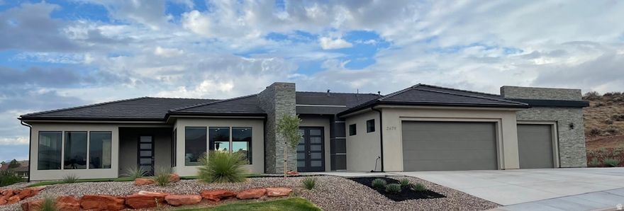 VIEWS VIEWS VIEWS! You've found the VIEWS you've been waiting for. Perfectly positioned above Sunbrook Woodridge Hole #3, this stunning custom home captures breathtaking 360 views of the golf course, surrounding landscape, and vibrant Southern Utah skies from nearly every room. Meticulously maintained with high-end appliances, induction cooktop, 8' solid wood doors, automatic blinds, rift oak cabinetry and flooring, plus five sheer walls, walk in butler pantry, and Soundproof room, wired for a hot tub, and move-in ready. Luxury living with unforgettable VIEWS.