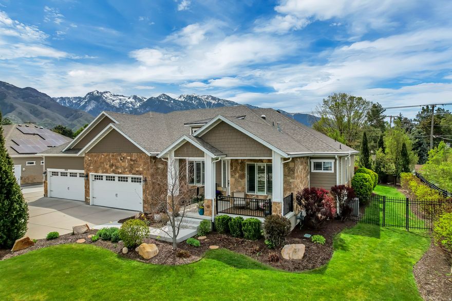**OPEN HOUSE SAT APR 25TH 11-2 PM** This stunning home combines luxury and comfort in one of the valley's most desirable neighborhoods. Located on a quiet cul de sac in the gated Royal Oaks community of Cottonwood Heights, the property offers Mt. Olympus views and is minutes from ski resorts and top schools. Set on a private .38 acre lot, the exterior includes a 4 car garage, RV parking, and a separate walkout basement entrance. The open floor plan features ceilings up to 13 feet and a rear wall of windows that fills the home with light. The main level includes a formal living room, guest powder room, and four bedrooms-each with a private en suite. One bedroom is currently used as a custom office. The primary suite includes a large walk in shower. A highlight of the home is the large family room perfect for gatherings, movie nights, and multi generational get togethers, with plenty of space for seating and entertaining. Designed for generational living, the lower level works as an independent living area with a full kitchen, large walk in pantry, a second laundry room, roomy living spaces, and a mini gym. With its own walkout entrance, it offers privacy and convenience for extended family or long term guests. Washer and dryer negotiable.