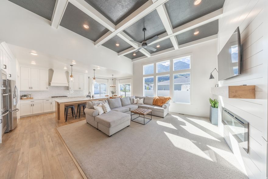 Offset your mortgage by approximately $1,900/month with a fully finished basement apartment-this is one of the most compelling opportunities in North Ogden at this price point. Built in 2020 and offering over 4,100 sq ft, this 7-bedroom home sits on a desirable corner lot and features a bright, open-concept layout  designed for both everyday living and entertaining. The main living area is filled with natural light and framed by large picture windows showcasing beautiful mountain views, while the spacious kitchen includes double ovens, abundant counter space, and a large walk-in pantry. Downstairs, the separate-entry 3 bedroom basement apartment includes a full kitchen, its own laundry, and private living space with a strong rental history of $1,900/month-ideal for offsetting your payment or accommodating extended family. With 2 kitchens, 2 laundry rooms, and flexible living space throughout, this home offers a rare combination of size, functionality, and income potential-all in a quiet, convenient North Ogden neighborhood near parks, schools, and outdoor recreation.