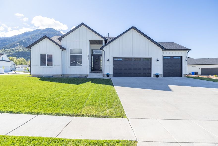 Spacious North Ogden home offering more room and true flexibility with a rare income producing basement apartment. Located on a .28 corner lot in a quiet and convenient neighborhood. This 2020-built home delivers over 4,100 sq ft, 7 bedrooms, 2 kitchens, 2 laundry rooms, and a bright open-concept, elevated layout designed for both everyday living and entertaining. The main living area is filled with natural light and framed by large picture windows showcasing beautiful mountain views.  The main kitchen is a standout with double ovens, ample counter space, and a large walk-in pantry. Downstairs, the fully finished basement with a separate entrance, full kitchen, laundry, and private living space offers exceptional versatility all with a strong history of generating $1,900 per month in rental income. This space offers buyers the flexibility to generate income or simply provide additional space for a growing family to expand. A rare opportunity to own a newer, larger home with mountain views, upgraded features, and flexible living options.