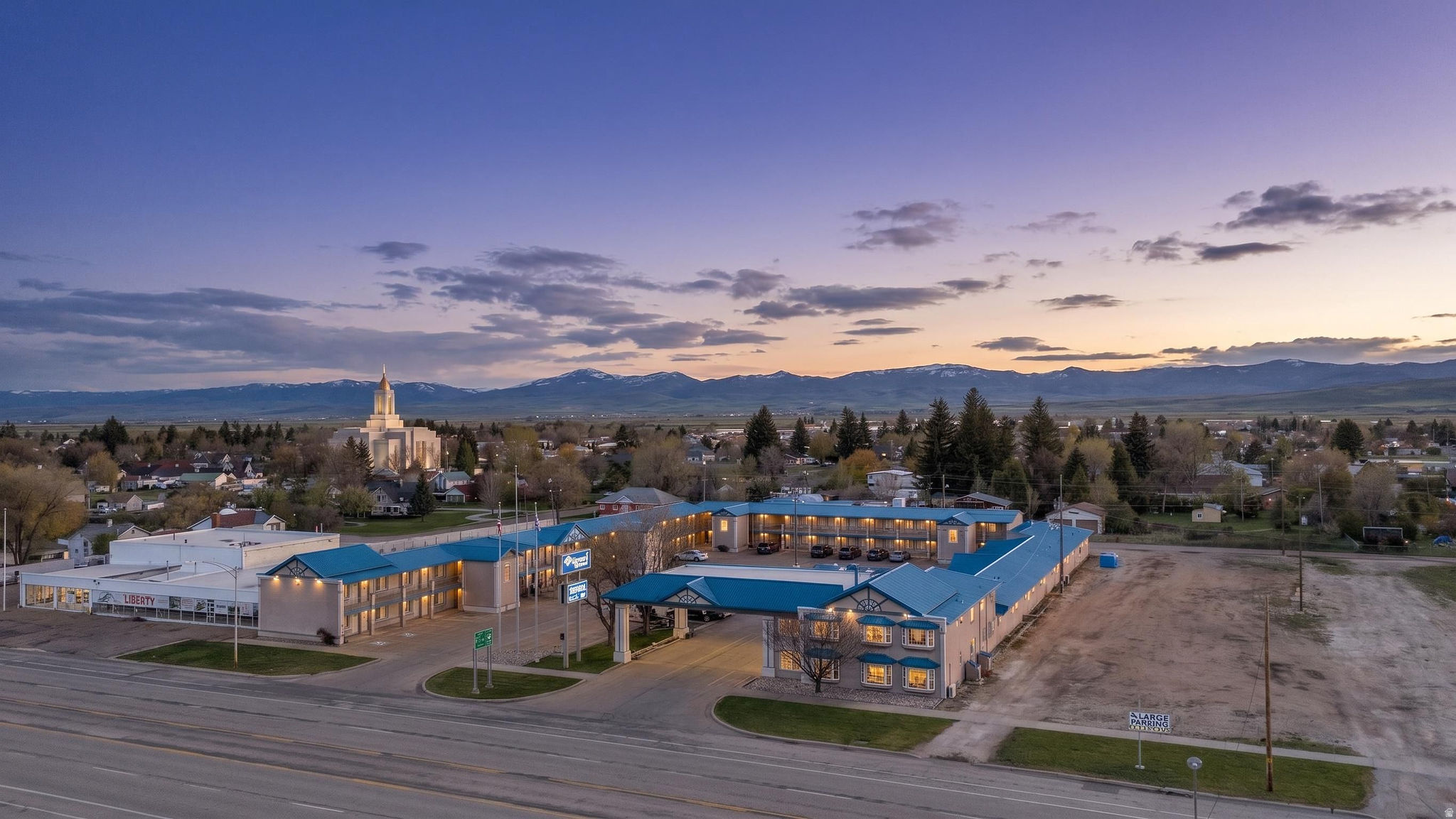 Commercial property featuring a multi-building complex with a prominent blue roof design