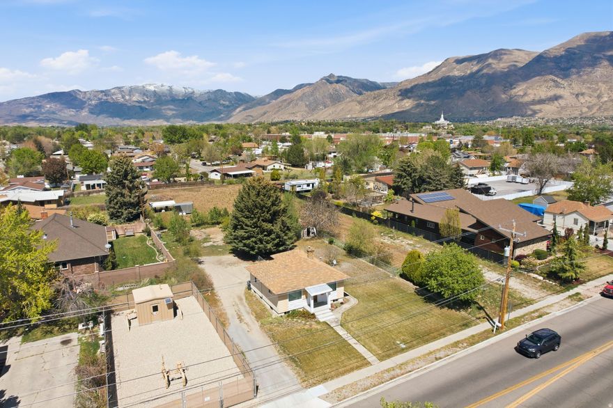 Rare opportunity to own 1.37 acres in the heart of American Fork. This property is a builder's dream with stunning mountain views and the space that's so hard to find in today's market. Keep the existing home or build your dream home exactly as you want it. Located minutes from American Fork Canyon, easy freeway access, shopping, dining, and Fox Hollow Golf Course. Don't miss this chance to build your future on land with real potential.