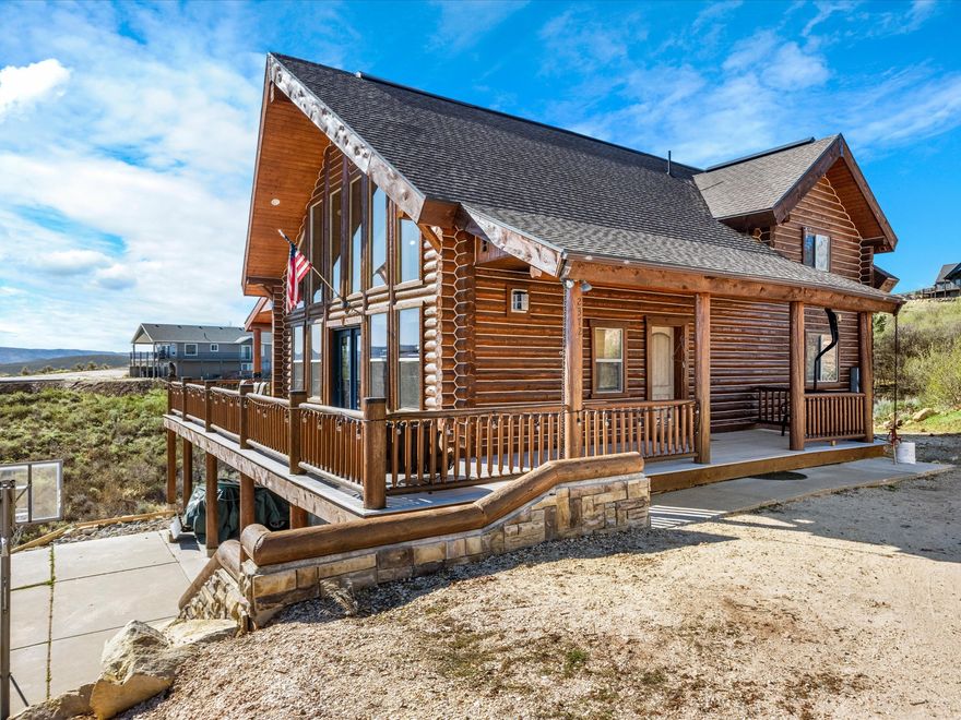Custom log home nestled at the end of a quiet Cul-de-sac on two spacious lots, offering breathtaking. unobstructed views of Bear Lake. Expansive picture windows bring the outdoors in, perfectly framing the lake and mountains. The home features granite countertops, stainless steel appliances, wrap around deck, and a warm inviting interior with rustic charm. Enjoy year-round access and the flexibility of short-term rental opportunities, making this property ideal as a primary residence, vacation or investment. For more info on rentals contact the HOA.    Square footage figures are provided as a courtesy estimate only. Buyer is advised to obtain an independent measurement.