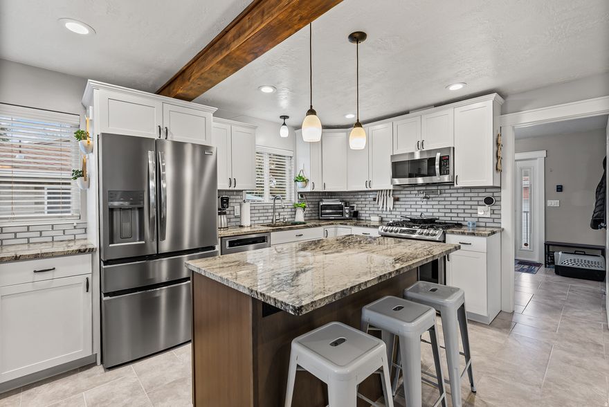 Beautifully remodeled 3,110 sq ft rambler located in the heart of the Salt Lake Valley! This stunning home features granite countertops, updated finishes throughout, and a spacious, functional layout. The fully finished basement includes a separate ADU apartment with its own private entrance, driveway, and patio-perfect for rental income, multigenerational living, or a private guest suite. Situated on a generous .25-acre lot, you'll enjoy both space and convenience, just minutes from shopping, dining, and freeway access. Recent upgrades include a brand new roof and a massive 1,248 sq ft detached garage, ideal for car enthusiasts, storage, or workshop space. With 5 bedrooms and 4 bathrooms, this home offers comfort, flexibility, and incredible value in a central Salt Lake Valley location. Agent is related to sellers. Square footage figures are provided as a courtesy estimate only and were obtained from appraisal and county records .  Buyer is advised to obtain an independent measurement.