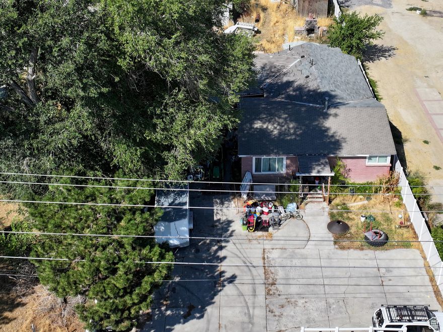 There are 3 parcels being sold together to equal 1.2 acres facing east on Redwood Rd. Listed with Parcel #21-34-377-034 and Parcel #21-34-377-022. The city has allowed .18 acre lots to the north and agreed that this would be allowed on these parcels as well. The road to the north is on title to be a right of way to these properties. THERE ARE TENANTS LIVING IN BOTH HOMES, PLEASE DO NOT DISTURB TENANTS OR THEIR PERSONAL PROPERTY. Please make an appointment with agent to view the properties. Square footage figures are provided as a courtesy estimate only and were obtained from the county. Buyer is advised to obtain an independent measurement.