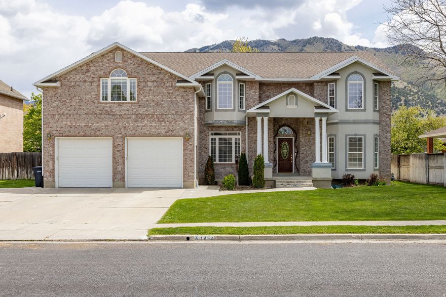 Welcome home to comfort, space, and unbeatable convenience in this desirable East Bench neighborhood-just minutes from USU and the hospital. This custom 5-bedroom, 3-bath home offers stunning mountain views from a thoughtfully designed layout designed for everyday living and entertaining. Step inside to a grand entry foyer that opens to spacious living areas, and a cozy double sided gas fireplace. The kitchen is built for both function and style with a large island and granite countertops-perfect for gathering. All bedrooms are generously sized, including a true master retreat with a private deck, walk-in closet, and en suite bath. The unfinished basement provides endless potential to make it your own, including a unique suspended garage with additional space underneath-ideal for a future home theatre-that also has direct access into the 3 car tandem garage. Outside, mature trees add privacy and charm, completing this home in a prime location. Buyer to verify all information.