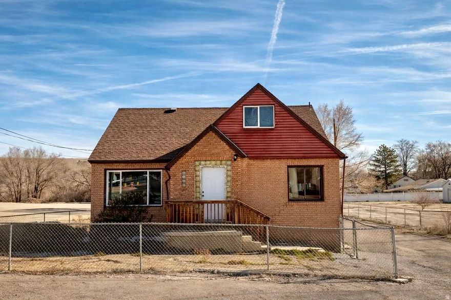 Unlock the potential at 489 S Highway 55-an affordable and uniquely laid-out home with space, character, and room to grow. This 3-bed, 3-bath property offers a practical floorplan with a spacious primary bedroom on the main level and two additional bedrooms tucked upstairs for added privacy. The main floor features a bright living room and a long galley-style kitchen with great cabinet storage and plenty of workspace. Downstairs, the wide-open basement provides a huge bonus area-perfect for storage, hobbies, a home gym, or future finishing if you want to add more living space or extra bedrooms. The partially fenced corner lot offers easy access to town and gives you room for parking, pets, or outdoor projects. Whether you're looking for an affordable home with solid bones or a property you can personalize over time, this one delivers space, flexibility, and great value in the heart of Price.   Square footage figures are provided as a courtesy estimate only using Cubicasa. County Records do not list Sq Ft for 2nd Story or Basement. Buyer is advised to obtain an independent measurement.