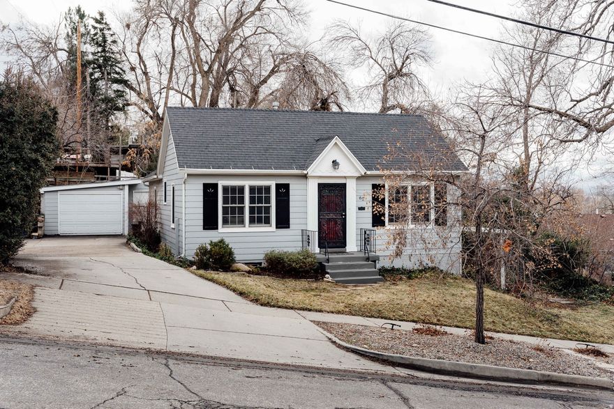 Like an oasis in the city, this bungalow tucked away in our much-beloved Marmalade neighborhood is about as charming and cozy as they come. Winters here are a solace, and spring is magical when the garden comes to life and birdsong fills the air. The owners have lovingly cared for this home. They've updated the kitchen and bathroom, completed the lower level and refreshed the outdoor patio. With hardwood floors, loads of niches and even a laundry chute, this home is full of character.  The lower level has a separate entrance and is already plumbed for a future second kitchen, making it perfect for an ADU. Oh, and did we mention the laundry chute?  A sturdy, detached garage sits at the end of a generous driveway with ample flat, off-street parking while a new retaining wall along the east side adds both space and functionality. Proximity to both local trails and Marmalade's vibrant community simply can't be beat. Local eateries and amenities abound, including the new Utah Film Center, a great hardware store, several coffee shops, and a Pilates studio-not to mention the Capitol is just right there.   With spring right around the corner, now is a great time to make your move. Homes like this rarely last long.