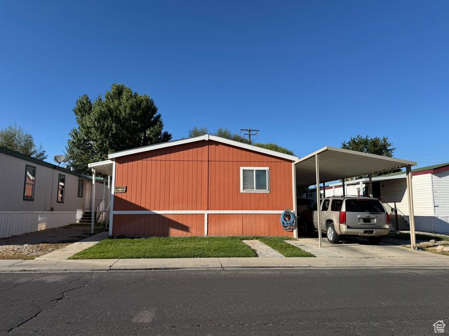Welcome to this well maintained move in ready double-wide manufactured home! Featuring an open concept floor plan with spacious living areas, this home is perfect for comfortable everyday living and entertaining. Conveniently and centrally located, you'll enjoy quick access to nearby shops, dining, and freeway entrances.  Square footage figures are provided as a courtesy estimate only. Buyer is advised to obtain an independent measurement.