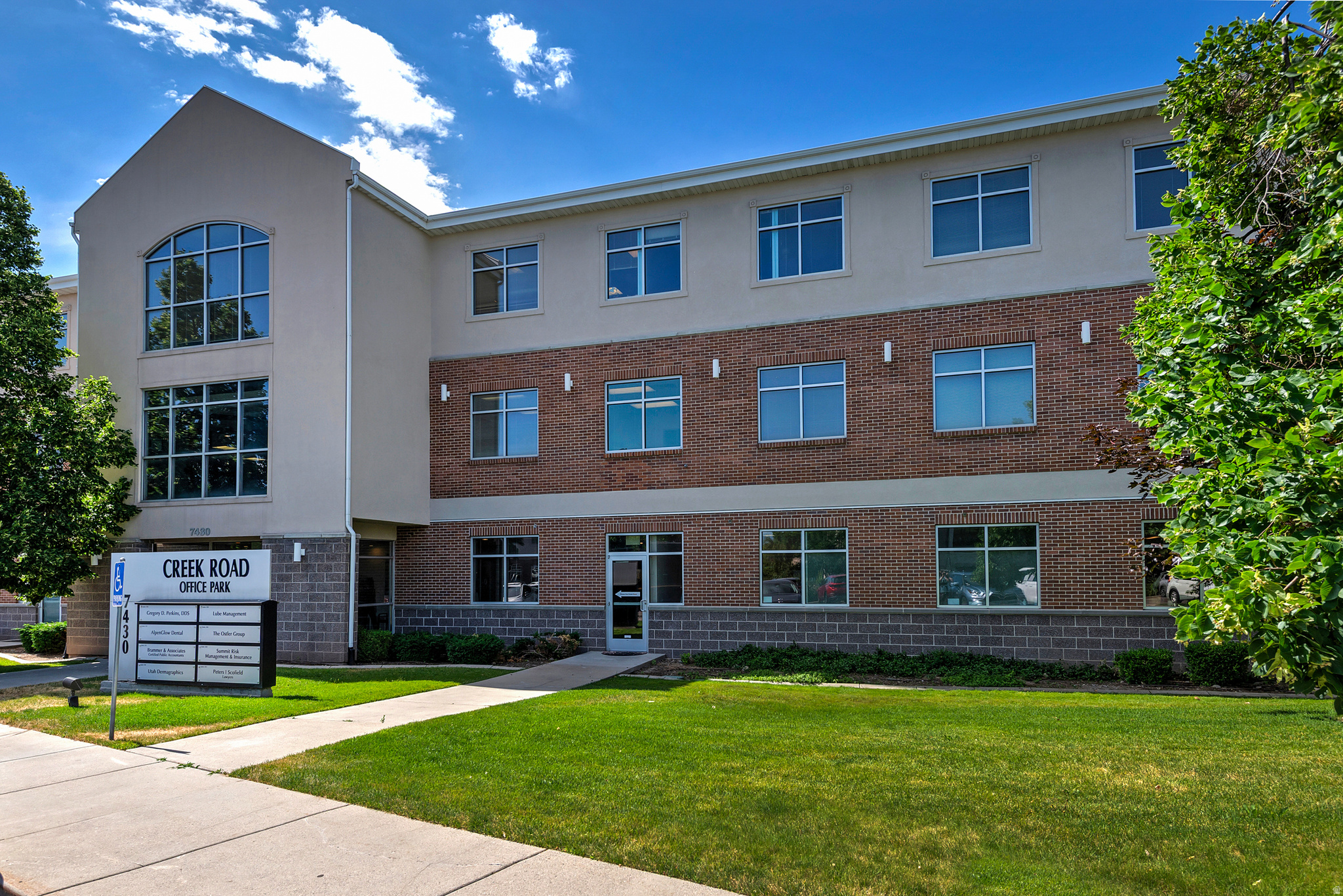 Multi-story commercial building featuring a brick and stucco exterior