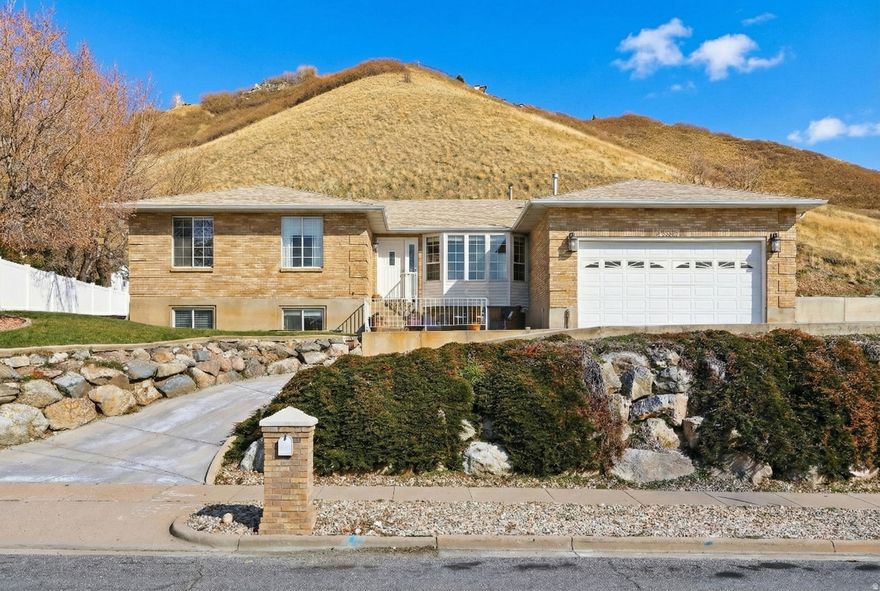 This is the seller's final price adjustment. The home is now priced firmly and competitively, offering by far the best value in the area. No further price reductions are planned. Serious buyers are encouraged to act quickly! Home sits on nearly a half-acre with HEATED DRIVEWAY, (room to turn car around on top), no backyard neighbors, and plenty of space to stretch out. Great layout, awesome views, privacy, natural light and best of all, the heated driveway means you never have to shovel snow again! Six bed, four bath, plus a dedicated office space (can be additional bedroom if needed). Recent updates include newer roof, high efficiency A/C and furnace, rain gutters with leaf-guards, window well covers, porch railings and newer LVP flooring throughout the upstairs, and professionally lacquered kitchen cabinets. Laundry on both levels! Plenty of additional parking to the west of garage. Schedule a tour today. Square footage figures are provided as a courtesy estimate only. Buyer is advised to obtain an independent measurement if desired.