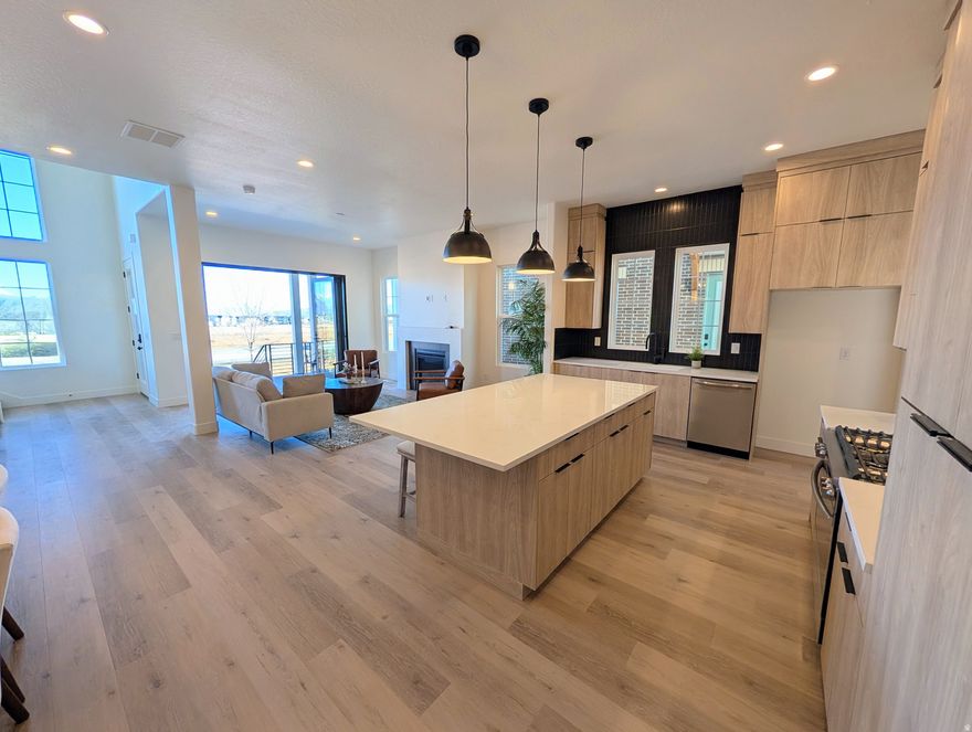 3% Preferred Lender incentive! Move-In Ready, Stunning Waterfront Home with Rentable ADU (apartment above the garage) and Spacious 3-Car Garage. Discover the perfect blend of versatility, comfort, and waterfront living with the brand-new Birmingham floorplan. This thoughtfully designed home offers an expansive layout, ideal for modern living and entertaining. The main living area is crafted for seamless indoor/outdoor living, featuring sliding doors that open to a spacious porch for enjoying the views along the waterfront. For those who love to cook, the home includes a large walk-in pantry, offering plenty of storage. The Primary bedroom features an upper deck with a pergola, providing a serene retreat. The standout feature of the Birmingham plan is the attached Accessory Dwelling Unit (ADU), offering endless possibilities-whether it's for rental income, a dedicated guest suite, or an extended living space. List price is a FINISHED ADU, along with the premium waterfront lot and designer upgrades and options!
