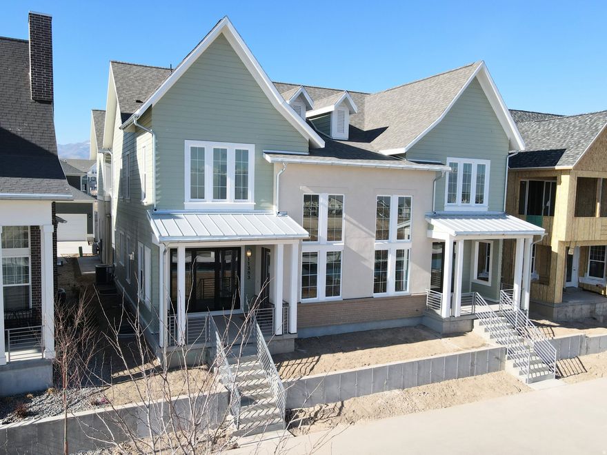 Stunning Waterfront Home with Rentable ADU (apartment above the garage) and Spacious 3-Car Garage. Discover the perfect blend of versatility, comfort, and waterfront living with the brand-new Birmingham floorplan. This thoughtfully designed home offers an expansive layout, ideal for modern living and entertaining. The main living area is crafted for seamless indoor/outdoor living, featuring sliding doors that open to a spacious porch for enjoying the views along the waterfront. For those who love to cook, the home includes a large walk-in pantry, offering plenty of storage. The Primary bedroom features an upper deck with a pergola, providing a serene retreat. The standout feature of the Birmingham plan is the attached Accessory Dwelling Unit (ADU), offering endless possibilities-whether it's for rental income, a dedicated guest suite, or an extended living space. List price is a FINISHED ADU, along with the premium waterfront lot and designer upgrades and options!