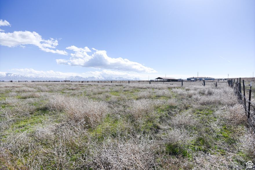 Zoned A-5, this property allows for a variety of uses including single-family homes, agriculture, and livestock (verify with county), opening up endless possibilities! Build your dream custom estate, create a horse property, cultivate a thriving hobby farm, or simply enjoy the wide-open space and natural beauty.  A valuable water well is already in place, and 1.75 acre-feet of water are available for separate purchase, a significant advantage for developing this property.  Seller financing is available with attractive terms, making your dream of owning this incredible property even more attainable.